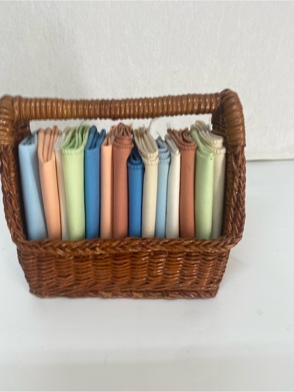 Wicker Basket Woven Rattan with Assorted Pastel Linens Cloths Storage Dainty